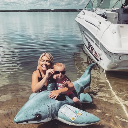 Shannon Ihrke having fun with her daughter at beach.